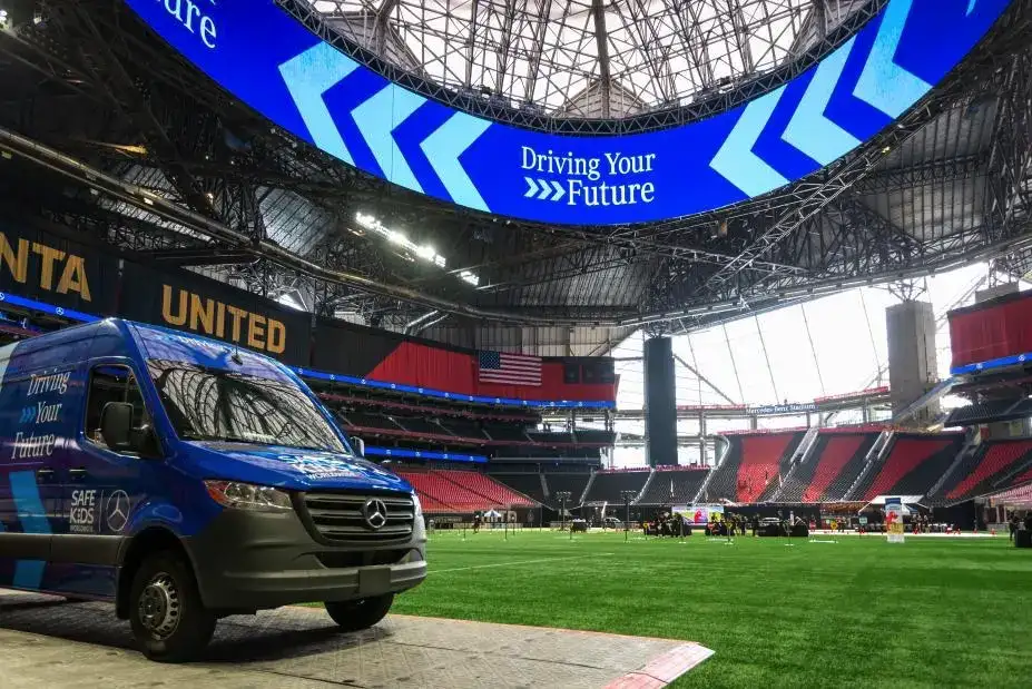 Mercedes Benz Sprinter Van on a field at an event for Driving your Future