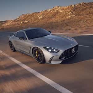 2026 Mercedes-Benz AMG GT Coupe Front and Passenger Side View in Motion