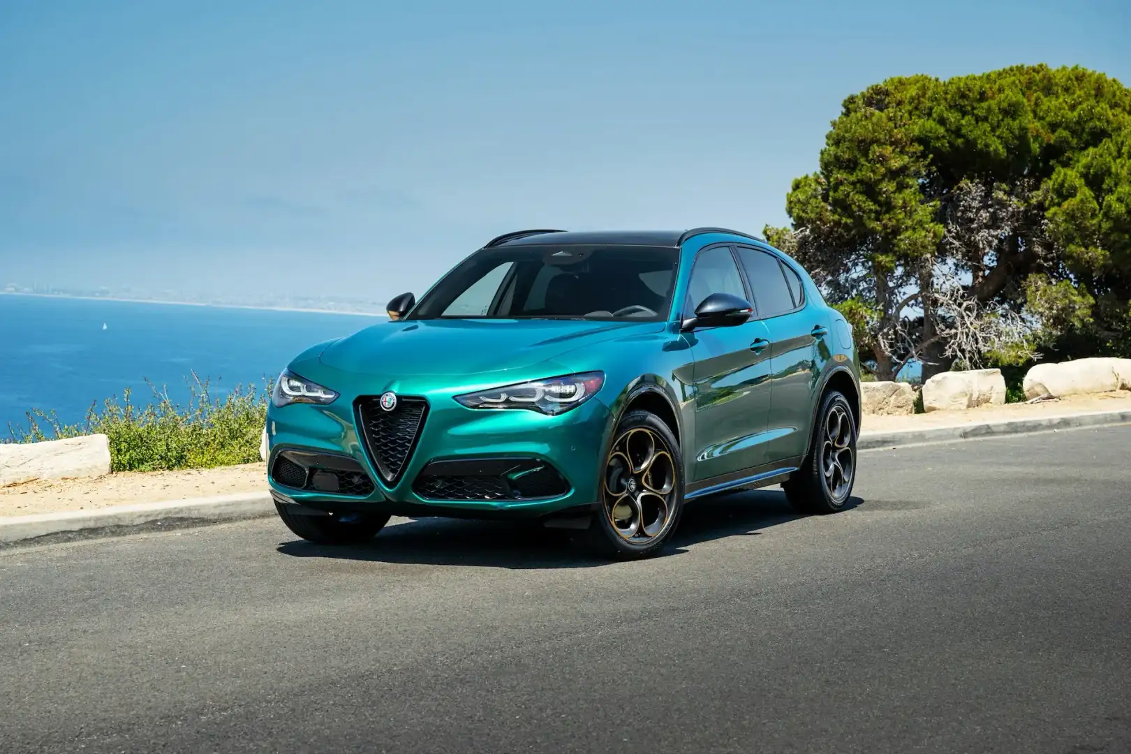 Alfa Romeo Stelvio parked near a beach