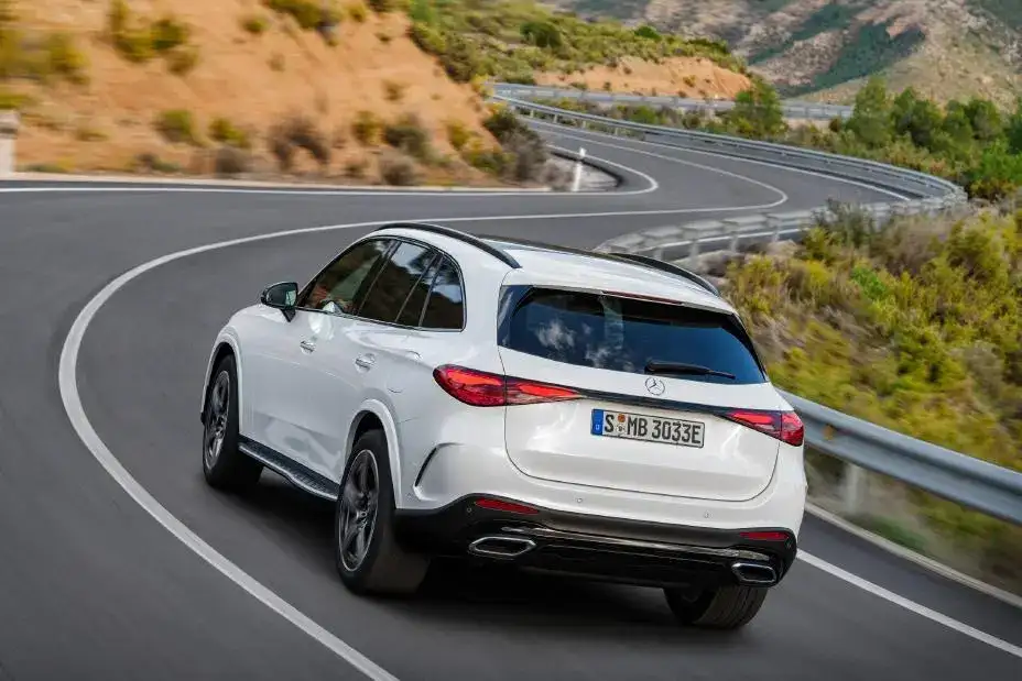 Mercedes-Benz GLC 300 view of the rear driving down a winding mountain road