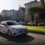 2026 Mercedes-Benz CLA driving in a neighborhood