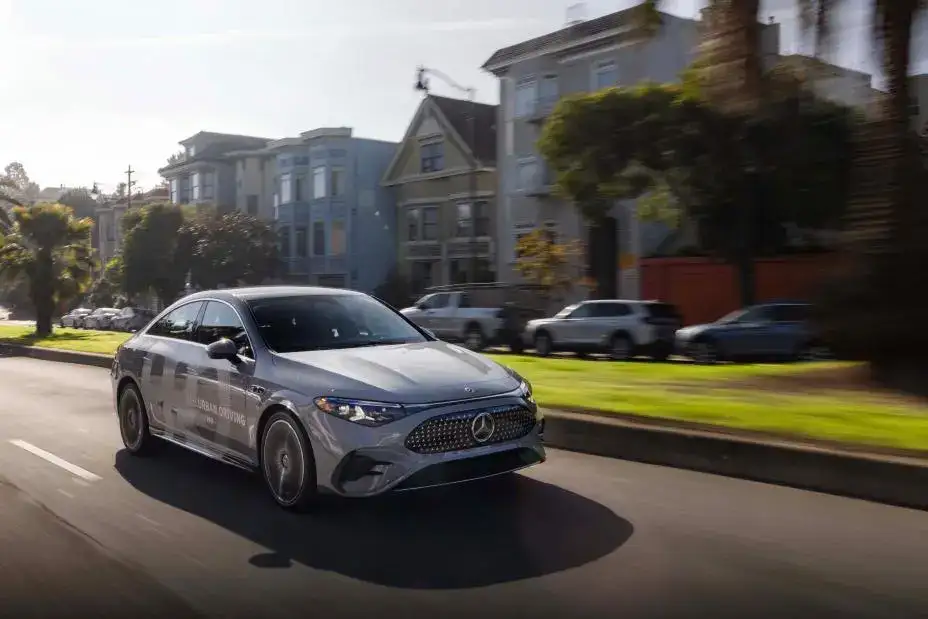 2026 Mercedes-Benz CLA driving in a neighborhood