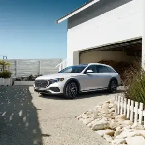2026 Mercedes Benz E Class Wagon E 450 4MATIC All Terrain white parked at a garage