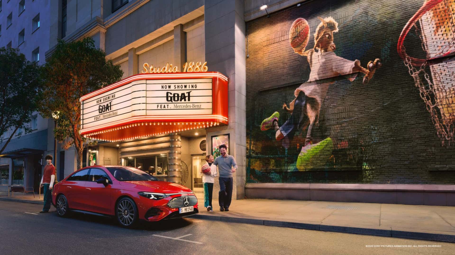 Mercedes-Benz Red Car in Front of GOAT Theatre Sign