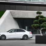 The Luxurious 2026 Mercedes-AMG(R) C 43, Parked In Front Of A Pristine And Modern Office Building