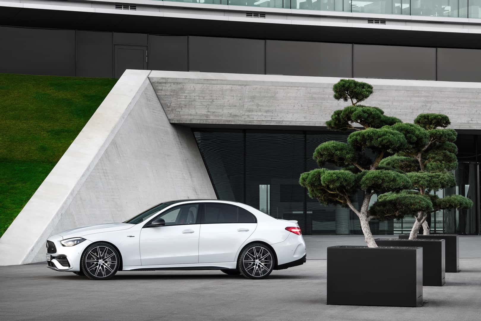 The Luxurious 2026 Mercedes-AMG(R) C 43, Parked In Front Of A Pristine And Modern Office Building