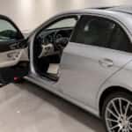 Pre-owned Mercedes-Benz E-Class with its service history on display at a Plano showroom