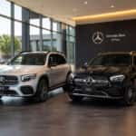 2026 Mercedes-Benz GLB and 2026 Mercedes-Benz GLC parked side by side at Mercedes-Benz of Plano showroom