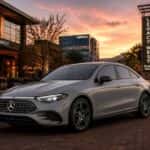 2026 Mercedes-Benz CLA 250+ with EQ Technology charging at a Plano, TX location at dusk