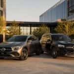 2026 Mercedes-Benz GLA and GLB side by side at a modern Plano, Texas corporate campus