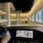 2026 Mercedes-Benz GLE SUV using Active Parking Assist with 360-degree surround view in a multi-level garage in Plano, TX