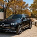 2026 Mercedes-Benz GLE at Arbor Hills Nature Preserve trailhead in October fall foliage, Plano TX