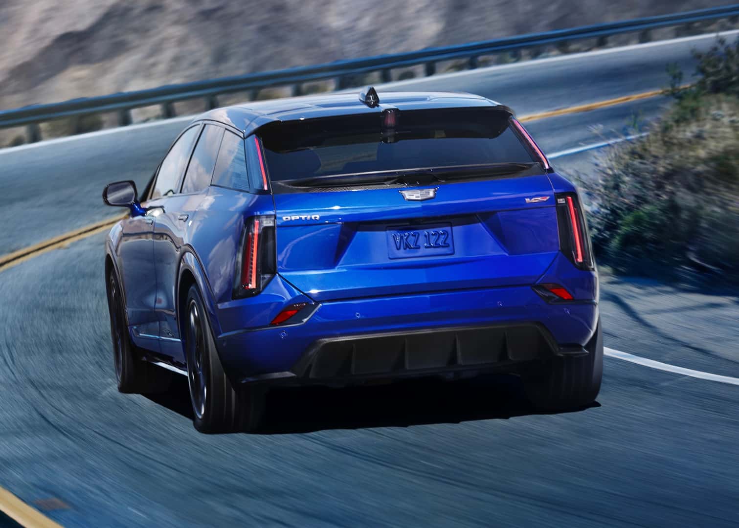2026 Cadillac Optic-V Rear View Driving on Road