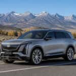 2027 Cadillac VISTIQ on a Northern Nevada highway with the Carson Range in the background