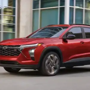 2026 Chevrolet Trax Apex Red driving in a city