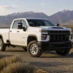 2026 Chevrolet Silverado 2500 HD on a gravel Nevada ranch road near Carson City with sagebrush and the Carson Range in the background