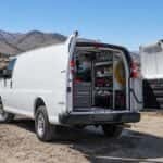 2026 Chevrolet Express Cargo van at a Nevada contractor job site with rear doors open showing upfitted interior