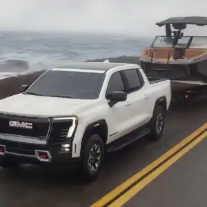 2026 GMC Sierra EV Towing a Boat