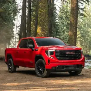 2026 GMC Sierra 1500 Cardinal Red in the woods