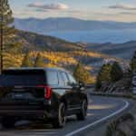 2026 GMC Yukon on US-50 near Spooner Summit in fall, aspens turning, heading toward Lake Tahoe from Carson City Nevada