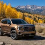 2026 GMC Acadia at a Hope Valley Highway 88 pullout surrounded by golden fall aspen trees near Carson City, NV