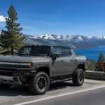 2026 GMC HUMMER EV Pickup on the Spooner Summit highway with Lake Tahoe in the background