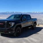 2026 GMC Sierra 1500 in Onyx Black parked at a high desert overlook near Carson City, Nevada, with the Carson Range in the background