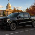 2026 GMC Sierra 1500 Crew Cab parked near downtown Carson City with the Nevada State Capitol in the background