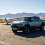 2026 GMC HUMMER EV Pickup on the tarmac at Carson City Airport with general aviation aircraft on display