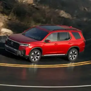 2026 Honda Pilot Elite Radiant Red Metallic II in motion
