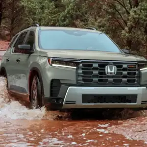 2026 Honda Pilot TrailSport Ash Green Metallic driving through water