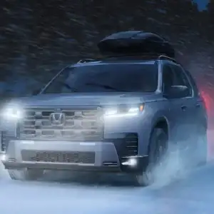 2026 Honda Pilot TrailSport Platinum White Pearl driving in snow