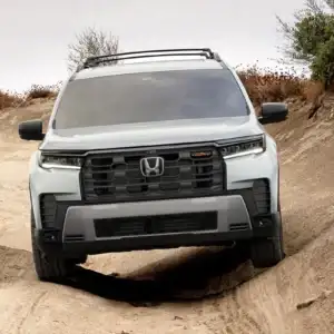 2026 Honda Pilot TrailSport Platinum White Pearl driving on sand