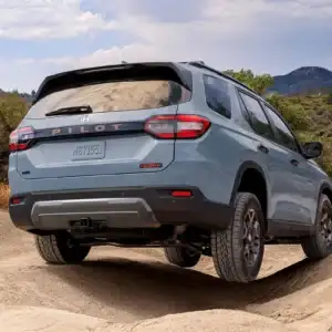2026 Honda Pilot Trailsport Sonic Gray Pearl rear view on sand