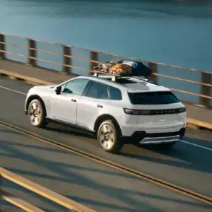 2026 Honda Prologue Elite Frostline White Pearl driving on a bridge