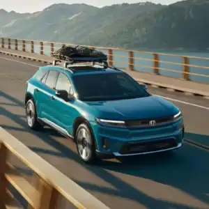 2026 Honda Prologue Elite North Shore Pearl driving over a bridge