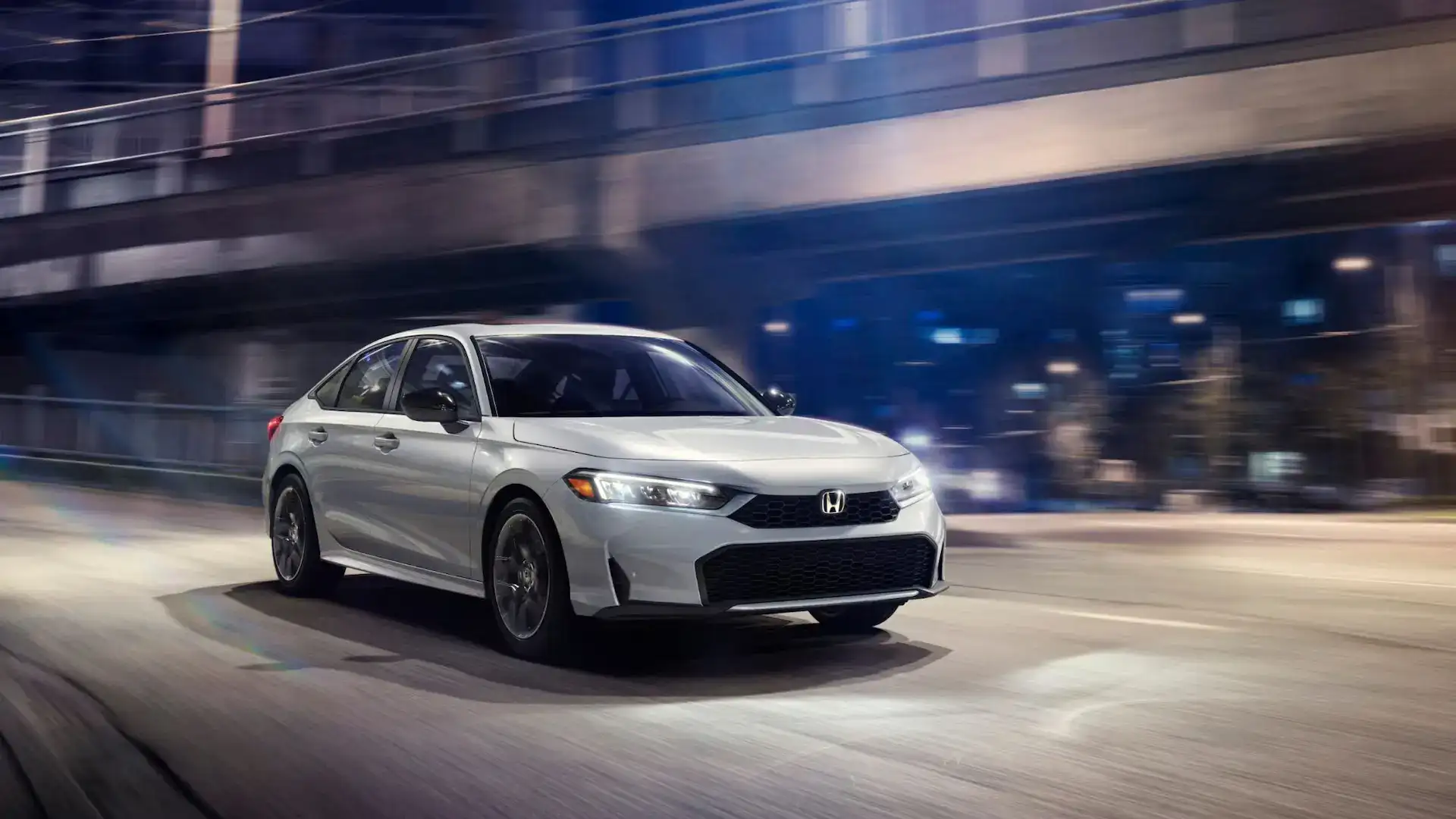 2026 Honda Civic Hybrid Sport Solar Silver Metallic in motion