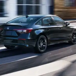 2026 Honda Civic Sedan Sport Hybrid Crystal Black Pearl in motion