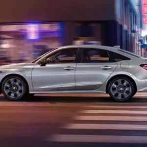 2026 Honda Civic Sedan Sport Touring Hybrid Solar Silver Metallic in motion
