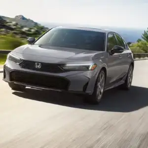 2026 Honda Civic Sedan Sport Touring Hybrid Urban Gray Pearl in motion