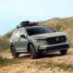 The Efficient Honda CR-V Trailsport Driving Over Dirt Roads And Hills