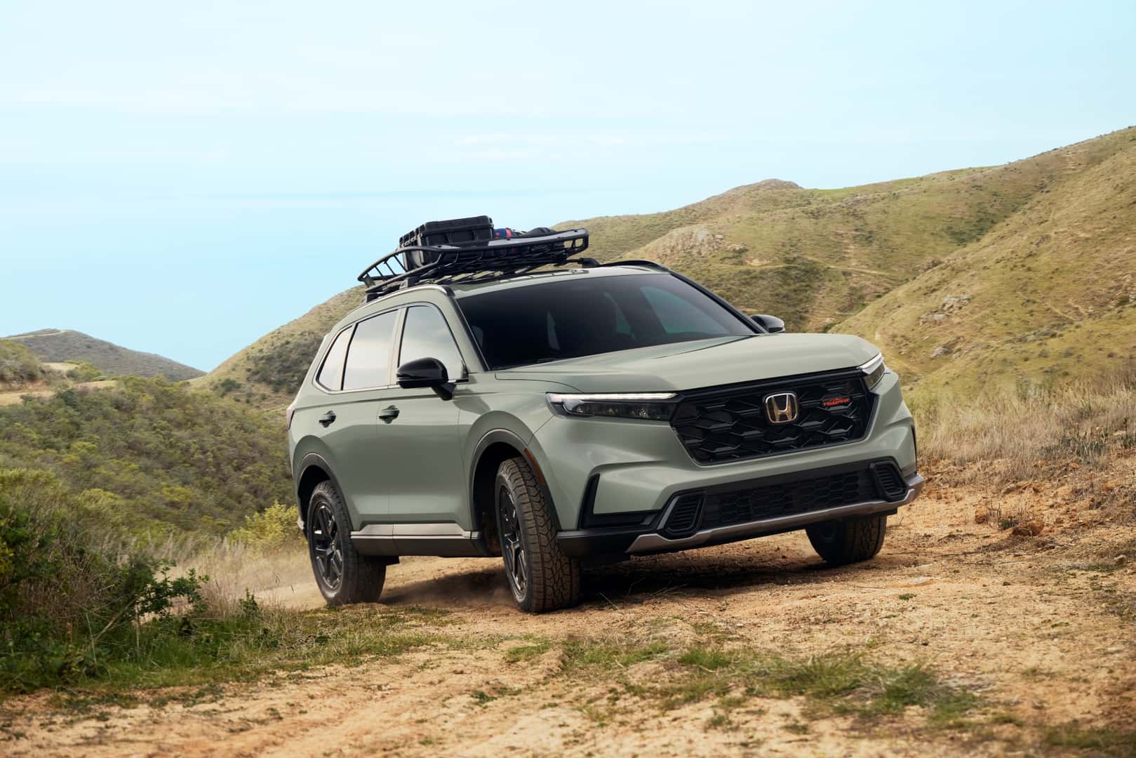 The Efficient Honda CR-V Trailsport Driving Over Dirt Roads And Hills
