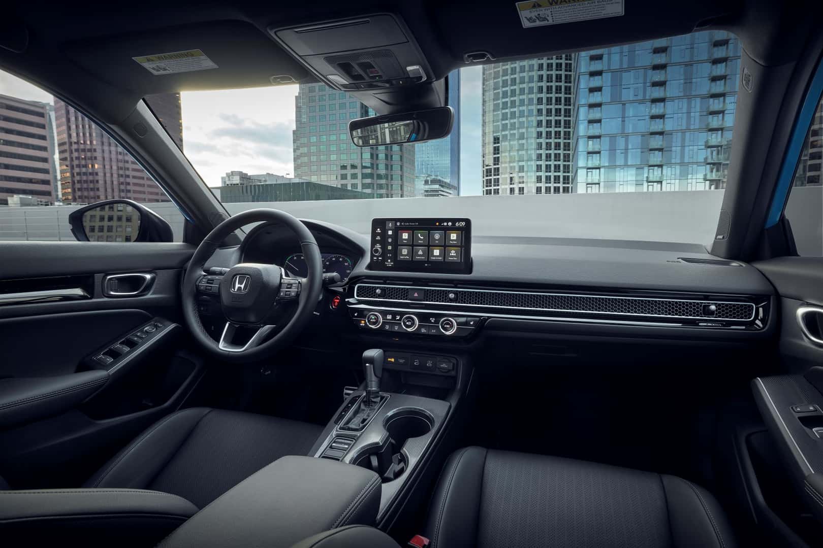 The Sleek And Fashionable Front Interior Of The Well-Reviewed Honda Civic Hatchback Sport Touring Hybrid