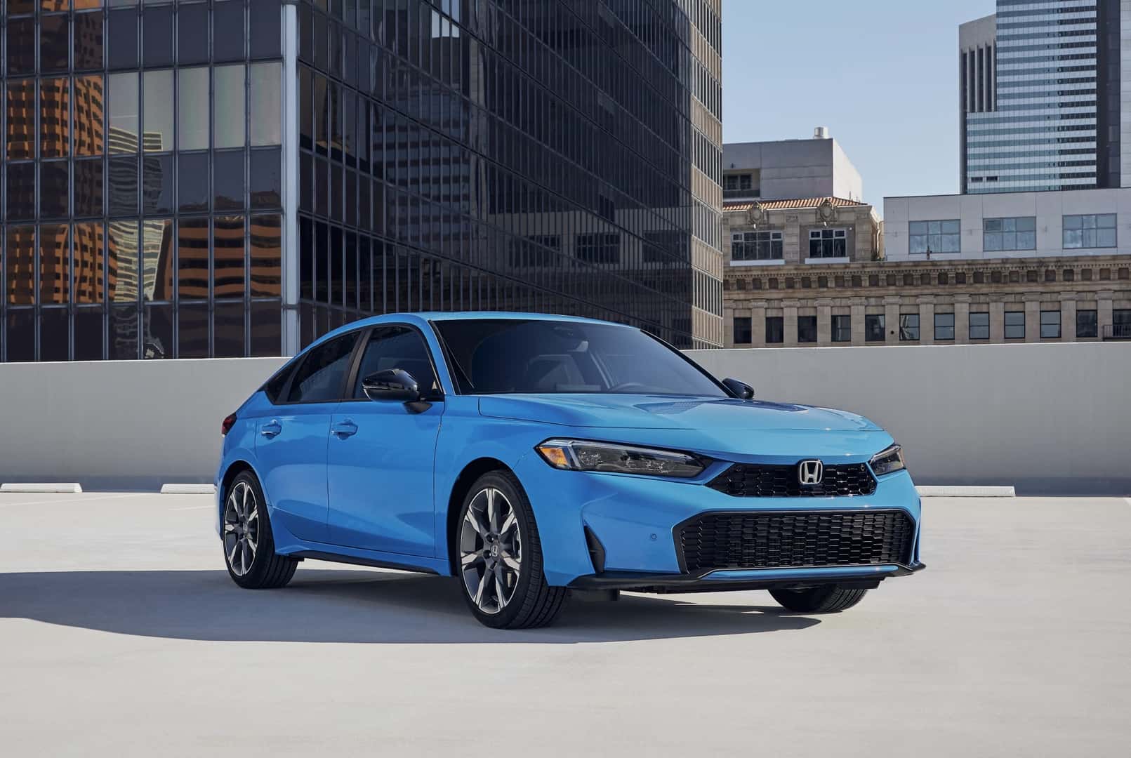 The Advantageous And Award-Winning 2026 Honda Civic Hatchback Sport Touring Hybrid, Parked On Top Of A Parking Garage