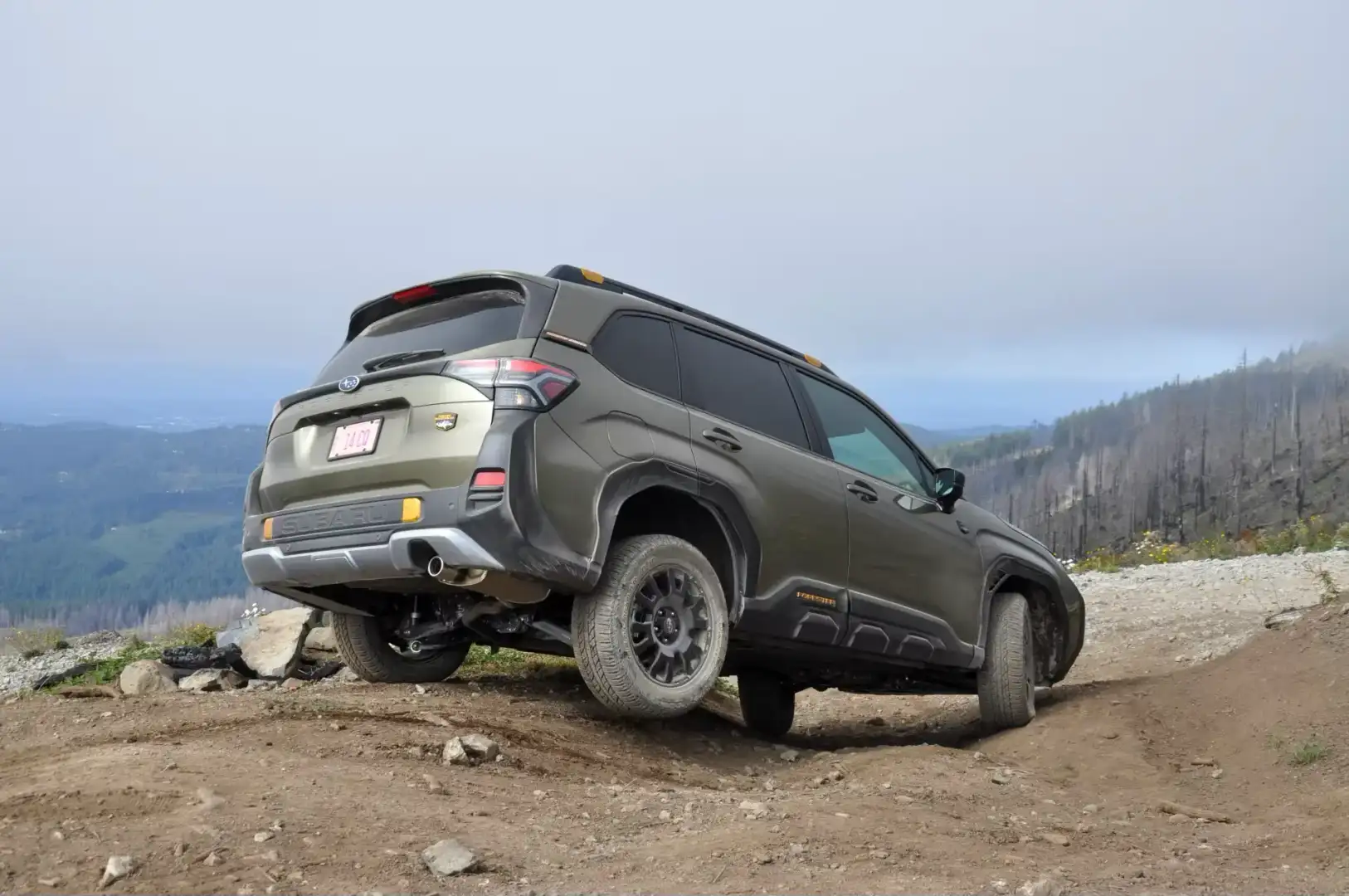 Subaru Forester off roading on a dirt mountain