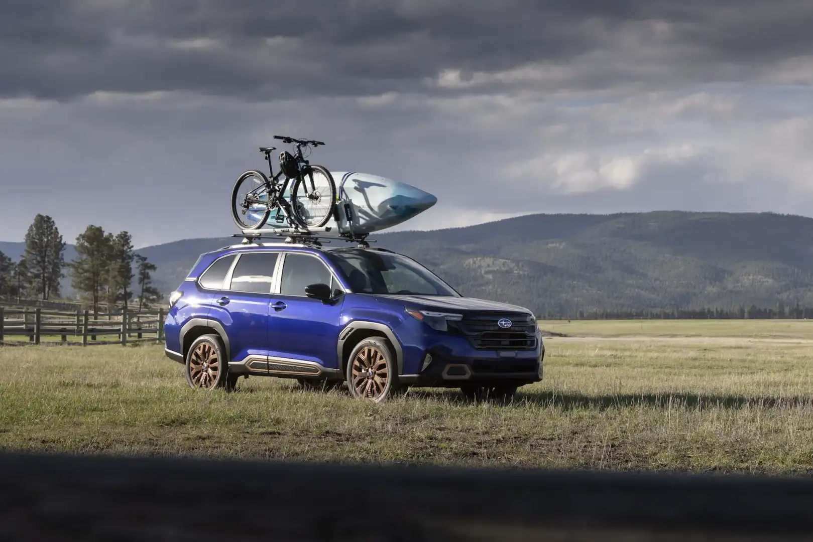 2026 Subaru Forester parked off road with a kayak rack on roof