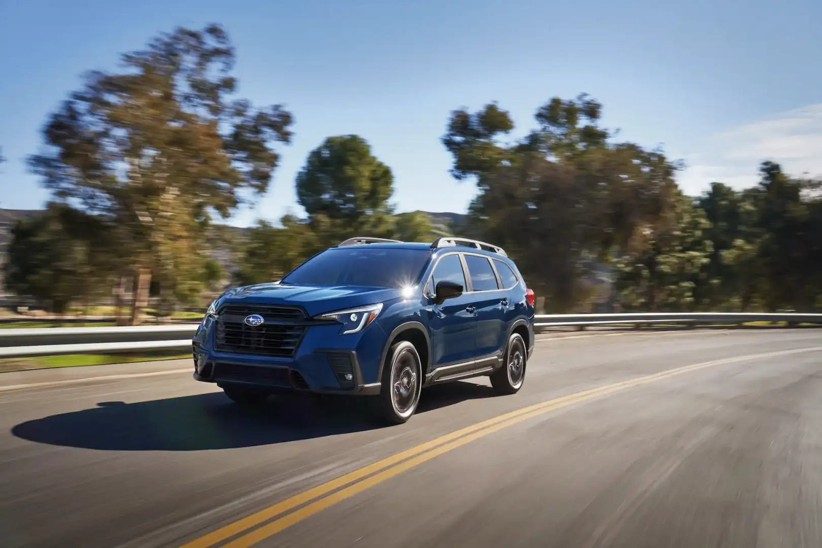 Blue 2026 Subaru Forester driving on the road
