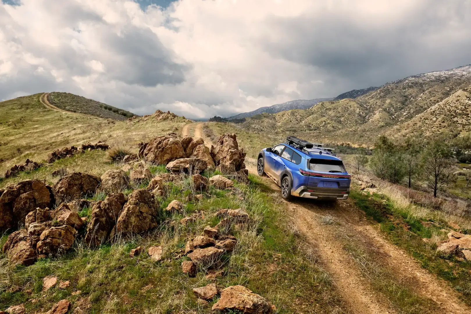 2026 Subaru Trailseeker off roading on a dirt path up hill