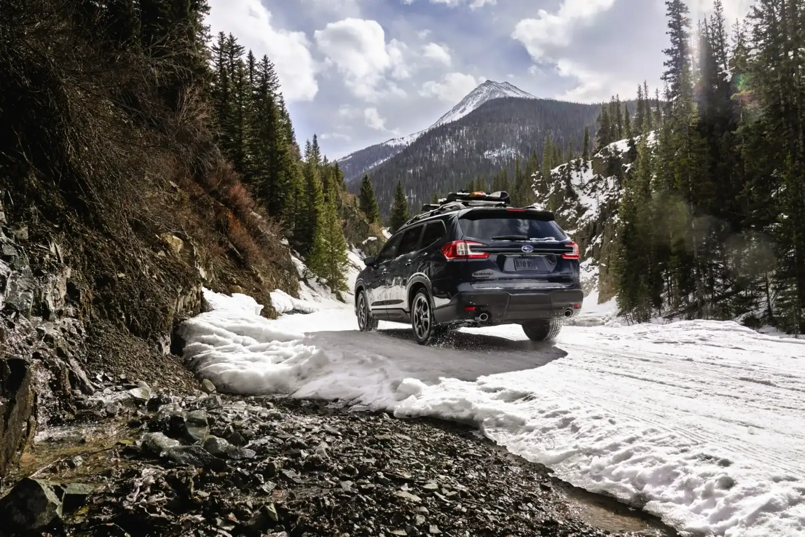 Subaru Ascent driving on snowy and icy mountain roads