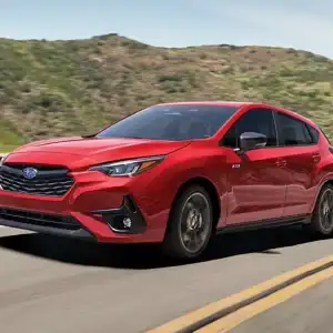 2026 Subaru Impreza Pure Red in motion